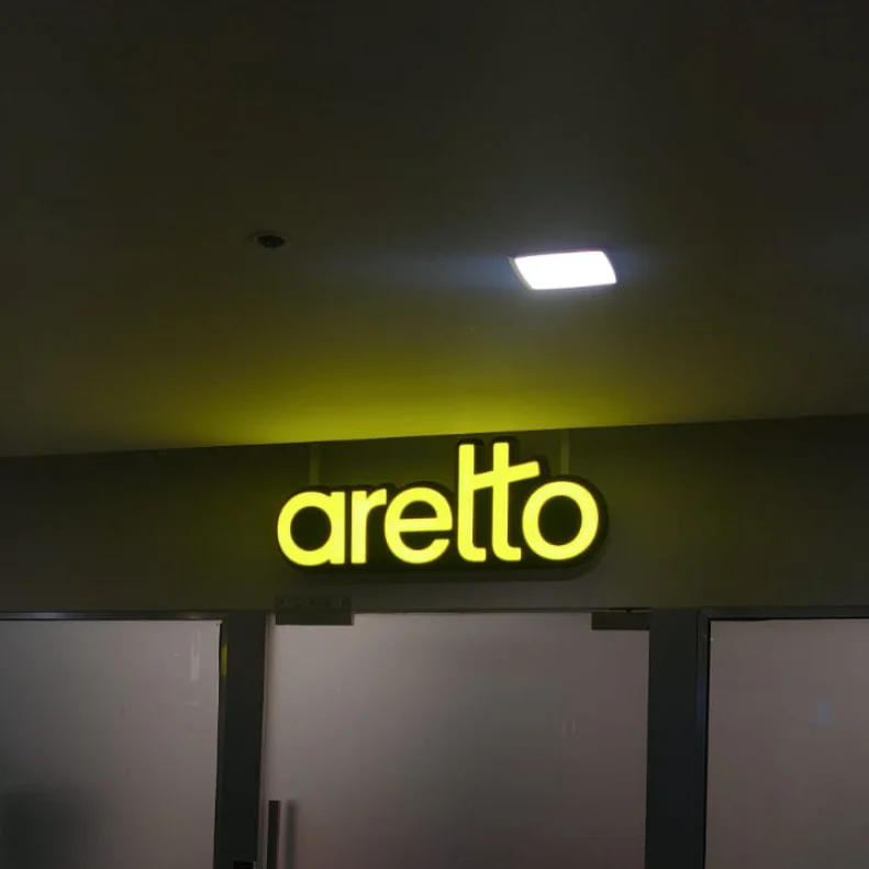 Illuminated aretto storefront lettering made and installed by ART CENTRRAL, Pune