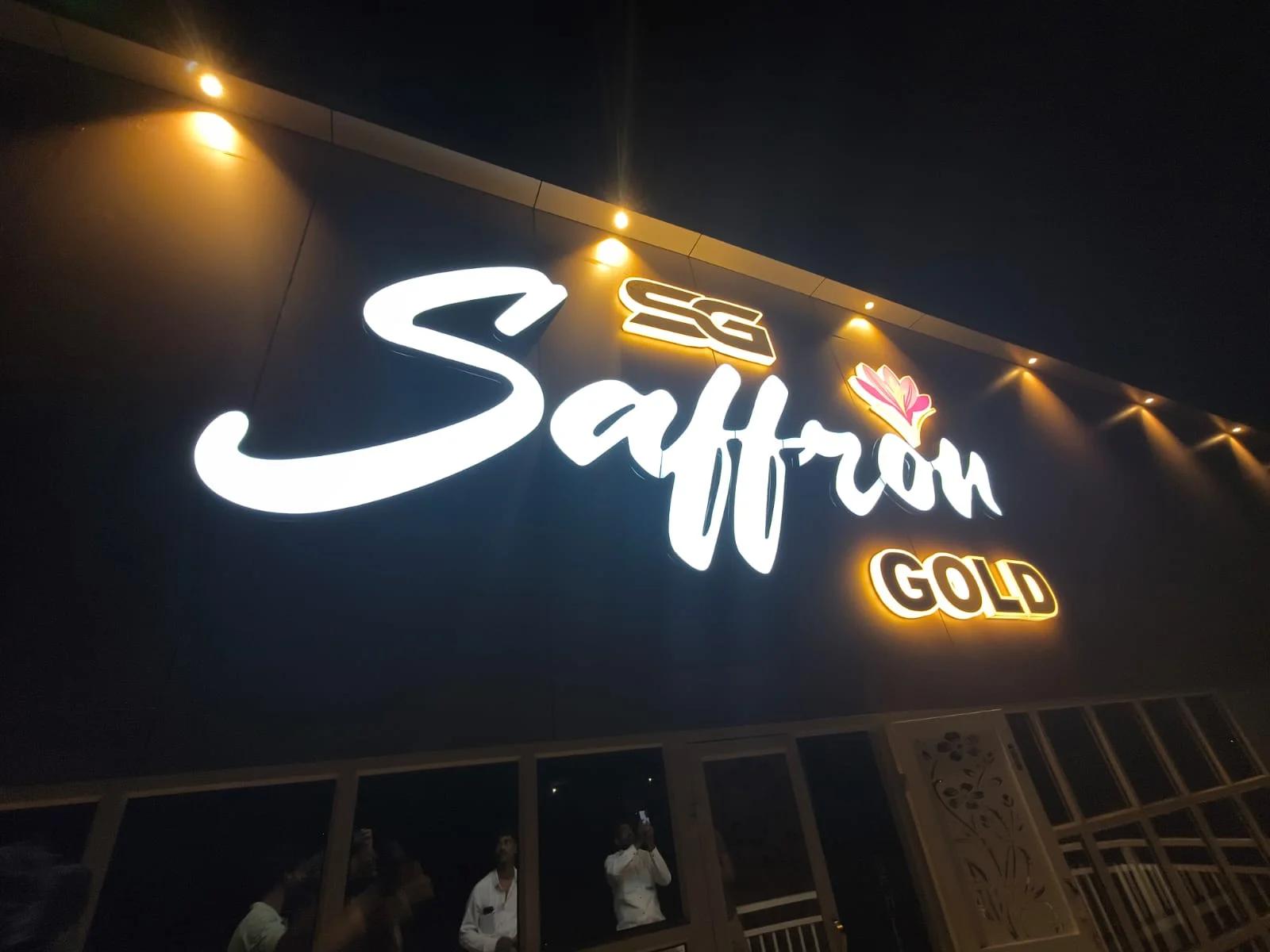 Illuminated Saffron Gold shopfront lettering made and installed by ART CENTRRAL, Pune