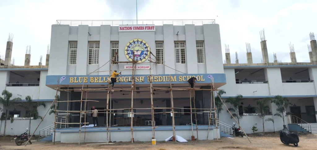 School building facade signage being installed by ART CENTRRAL, Pune